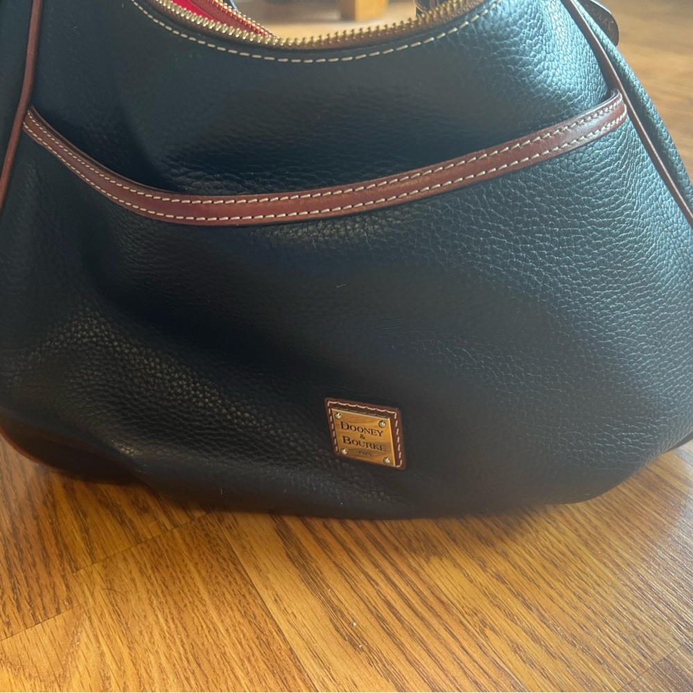 Dooney & Bourke Black Pebbled Leather Hobo with Brown Trim and Gold Plaque
